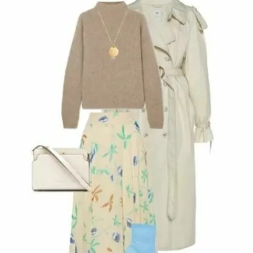 Модный наряд для весны с длинной юбкой, светлым свитером и тренчем в уютной обстановке, идеальный для прогулок по городу