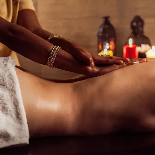 Relaxing massage session at a serene spa with soft candlelight and soothing ambiance for ultimate relaxation
