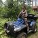 Женщина на квадроцикле в лесу летом - превью 9