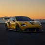 Желтая гоночная машина на трассе во время заката - превью 1